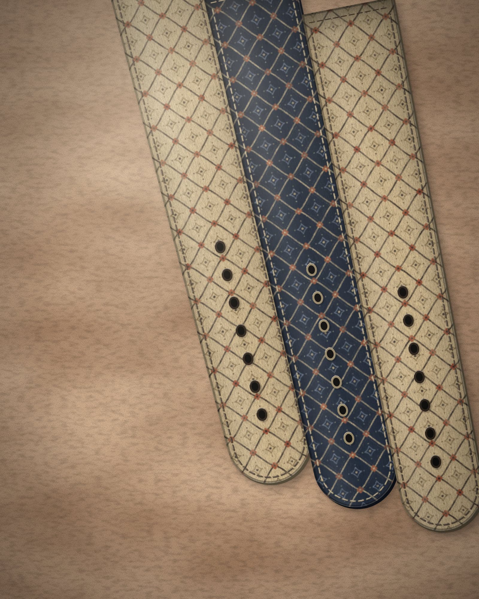 Concept straps in ochre and midnight lattice prints on a warm sandstone surface.